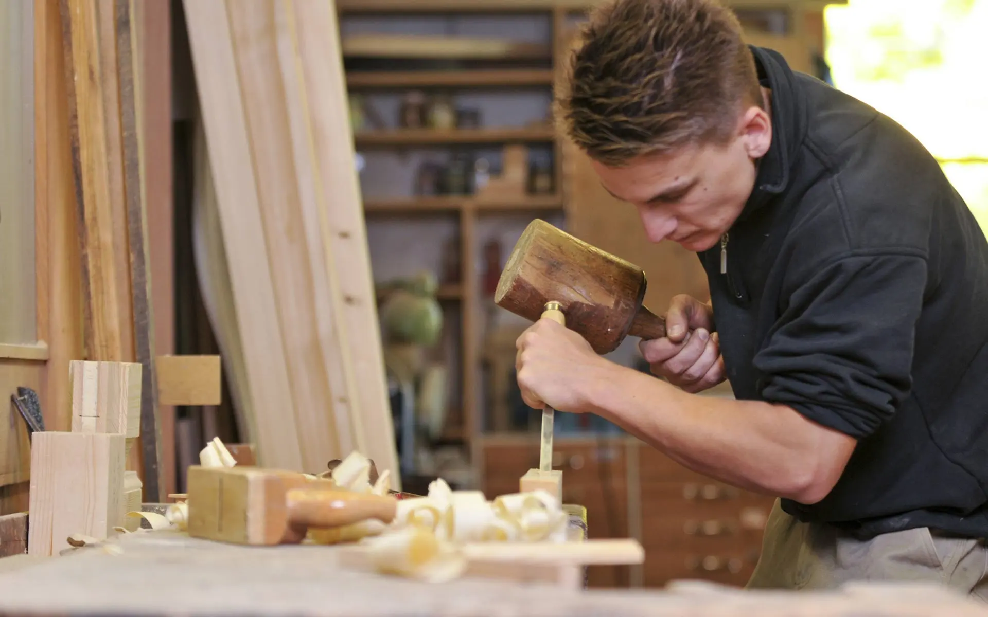 Joiner chiselling in the workshop