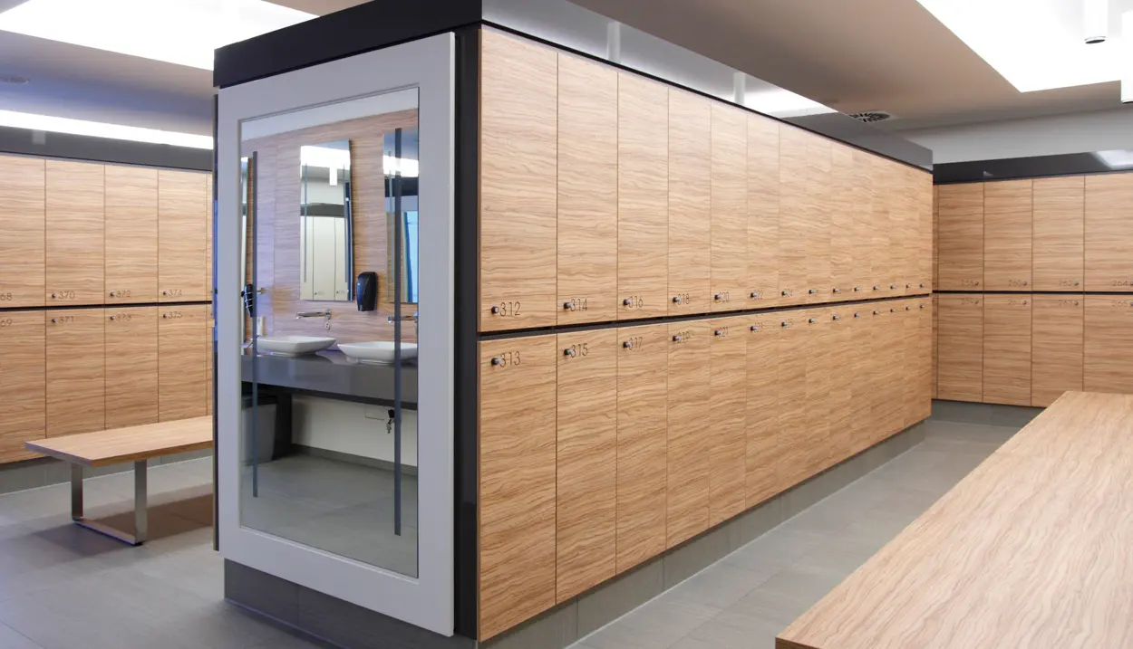 Dark wood lockers with a bench